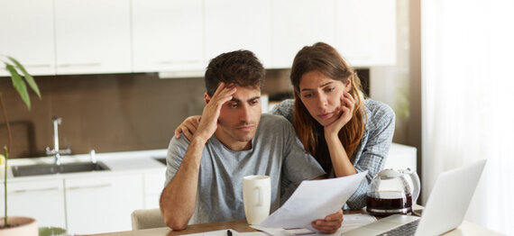 young-couple-checking-their-family-budget-1-750x500.jpg